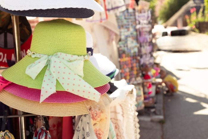 how to sell summer hats in 2024 - summer hats on the display at market