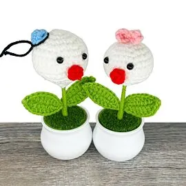 Crochet Flowers with Male and Female Duckling Designs in Pot