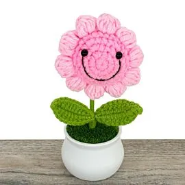 smiling pink crochet sunflower in pot