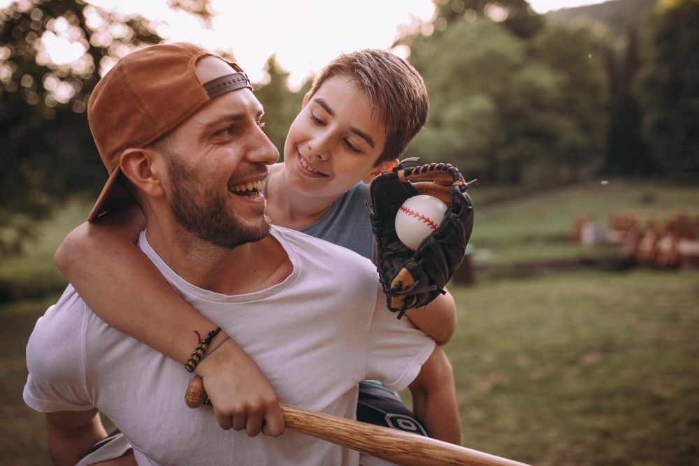 dad and his son playing baseball