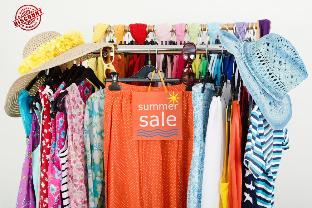 displaying summer hats and clothing and discount sign